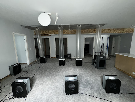 Technician performing emergency water removal in Utah County home